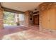Brick house with covered entryway and terracotta tile flooring at 2166 E Caroline Ln, Tempe, AZ 85284