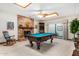 Game room featuring a pool table, fireplace, and sliding glass doors at 2166 E Caroline Ln, Tempe, AZ 85284