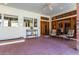 Covered patio with tile flooring, comfortable seating, and ceiling fan at 2166 E Caroline Ln, Tempe, AZ 85284