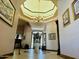 Elegant entryway with high ceilings and a grand chandelier at 2166 E Caroline Ln, Tempe, AZ 85284