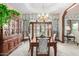 Formal dining room with a large wooden table and access to a patio at 2166 E Caroline Ln, Tempe, AZ 85284