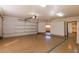 Large garage with overhead door, offering plenty of space for vehicles and storage at 2166 E Caroline Ln, Tempe, AZ 85284