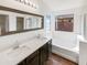 Double vanity bathroom with soaking tub and separate shower at 4657 W Carson Rd, Laveen, AZ 85339