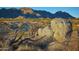 Desert landscape with mountains in background and large rocks at 24450 N 132Nd Pl, Scottsdale, AZ 85255