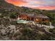 Aerial view of a luxurious home with a pool and desert landscaping at 11155 E Honda Bow Rd, Scottsdale, AZ 85262