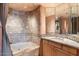 Bathroom with tiled shower/tub combo and granite countertop vanity at 11155 E Honda Bow Rd, Scottsdale, AZ 85262