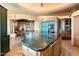 Spacious kitchen with a large island, custom cabinetry, and a breakfast bar at 11155 E Honda Bow Rd, Scottsdale, AZ 85262