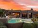 Stunning pool and spa with expansive patio, offering breathtaking sunset views at 11155 E Honda Bow Rd, Scottsdale, AZ 85262