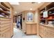 Large walk-in closet with ample shelving and hanging space at 11155 E Honda Bow Rd, Scottsdale, AZ 85262
