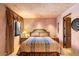 Cozy bedroom with a double bed, nightstands, and window with curtains at 11155 E Honda Bow Rd, Scottsdale, AZ 85262