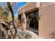 Exterior view of home with stucco siding and a glass entry door at 11155 E Honda Bow Rd, Scottsdale, AZ 85262
