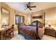 Spacious bedroom with a large bed, desk and seating area at 11155 E Honda Bow Rd, Scottsdale, AZ 85262