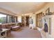 Spacious living room with a fireplace and comfortable seating at 11155 E Honda Bow Rd, Scottsdale, AZ 85262
