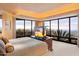 Luxurious Primary bedroom with stunning sunset views and a large TV at 11155 E Honda Bow Rd, Scottsdale, AZ 85262