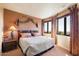 Bedroom with a double bed and mountain views from the window at 11155 E Honda Bow Rd, Scottsdale, AZ 85262