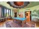 Game room features a pool table, wet bar, and ornate ceiling at 11155 E Honda Bow Rd, Scottsdale, AZ 85262