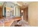 Bathroom with double vanity, large mirror and access to walk-in closet at 11155 E Honda Bow Rd, Scottsdale, AZ 85262