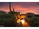 Outdoor fire pit nestled amongst desert landscaping, perfect for evening ambiance at 11155 E Honda Bow Rd, Scottsdale, AZ 85262