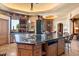 Gourmet kitchen boasts a large island with granite countertops and stainless steel appliances at 11155 E Honda Bow Rd, Scottsdale, AZ 85262