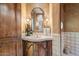 Upscale powder room with a pedestal sink and decorative stone tile at 11155 E Honda Bow Rd, Scottsdale, AZ 85262