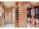 Custom-designed walk-in closet with mirrored doors and shelving at 11155 E Honda Bow Rd, Scottsdale, AZ 85262