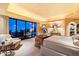 Luxurious bedroom with fireplace and large windows at 11155 E Honda Bow Rd, Scottsdale, AZ 85262