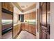 Well-equipped kitchen with light wood cabinets and stainless steel appliances at 11155 E Honda Bow Rd, Scottsdale, AZ 85262