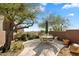 Peaceful patio with seating area, mountain views, and desert landscaping at 11155 E Honda Bow Rd, Scottsdale, AZ 85262