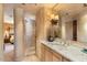 Elegant bathroom with a large shower, granite vanity, and views into the bedroom at 11155 E Honda Bow Rd, Scottsdale, AZ 85262