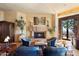 Cozy living room with fireplace and seating area at 11155 E Honda Bow Rd, Scottsdale, AZ 85262