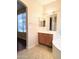 Bathroom with double vanity and view into another room at 20391 N 53Rd Ave, Glendale, AZ 85308