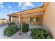 Front view of the house with covered entryway and desert landscaping at 265 Shawnee Dr, Wickenburg, AZ 85390