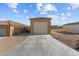 Detached garage with a light-colored door, offering additional storage space at 265 Shawnee Dr, Wickenburg, AZ 85390