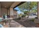 Relaxing front porch with small table and chairs, overlooking the neighborhood at 19428 W Colter St, Litchfield Park, AZ 85340