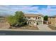 Two-story house exterior, landscaping, driveway, and mountain views at 19428 W Colter St, Litchfield Park, AZ 85340