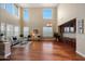 Bright living room with hardwood floors, high ceilings and built-in cabinetry at 19428 W Colter St, Litchfield Park, AZ 85340