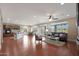 Open living room and kitchen with hardwood floors at 19428 W Colter St, Litchfield Park, AZ 85340