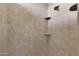 Clean shower with tile surround and built-in shelves at 19428 W Colter St, Litchfield Park, AZ 85340