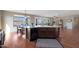 Open concept kitchen with island and hardwood floors at 19428 W Colter St, Litchfield Park, AZ 85340