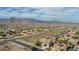 Aerial view of house and neighborhood, mountains in distance at 19428 W Colter St, Litchfield Park, AZ 85340