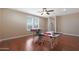 Home office or craft room with hardwood floors, two work tables and chair at 19428 W Colter St, Litchfield Park, AZ 85340