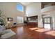 Spacious living room with hardwood floors, high ceilings, and built-in shelving at 19428 W Colter St, Litchfield Park, AZ 85340