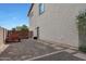 Side yard with gravel and a small storage area at 19428 W Colter St, Litchfield Park, AZ 85340
