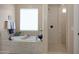 Spa-like bathroom with soaking tub and separate shower at 19428 W Colter St, Litchfield Park, AZ 85340