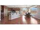 Eat-in kitchen with hardwood floors and granite counters at 19428 W Colter St, Litchfield Park, AZ 85340