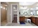 Bathroom with double vanity, walk-in closet, and shower at 19428 W Colter St, Litchfield Park, AZ 85340