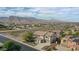 Aerial view of two-story house with pool, mountains in background at 19428 W Colter St, Litchfield Park, AZ 85340