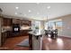 Kitchen with granite countertops, dark wood cabinets and island at 19428 W Colter St, Litchfield Park, AZ 85340