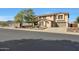 Two-story house with a three-car garage and landscaped front yard at 19428 W Colter St, Litchfield Park, AZ 85340