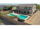 Backyard oasis with pool, putting green, and basketball hoop at 19428 W Colter St, Litchfield Park, AZ 85340